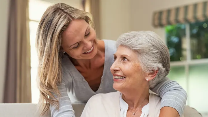 mother and daughter smiling at each other